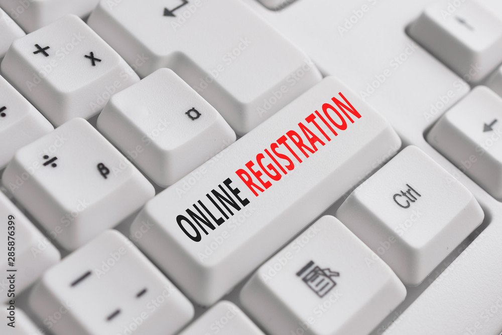 Writing note showing Online Registration. Business concept for System for subscribing or registering via the Internet White pc keyboard with note paper above the white background
