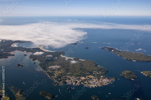 Aerial Landscape View of a touristic town  Tofino  on the Pacific Ocean Coast during a sunny summer morning. Taken in Vancouver Island  British Columbia  Canada.