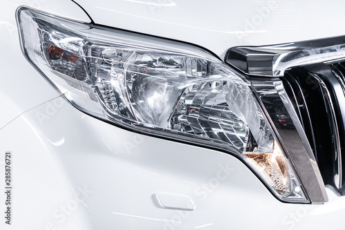 Macro view of modern white car xenon lamp headlight
