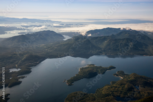 Aerial Landscape View of Kennedy Lake and Pacific Ocean Coast during a sunny summer morning. Taken near Tofino and Ucluelet, Vancouver Island, British Columbia, Canada. © edb3_16