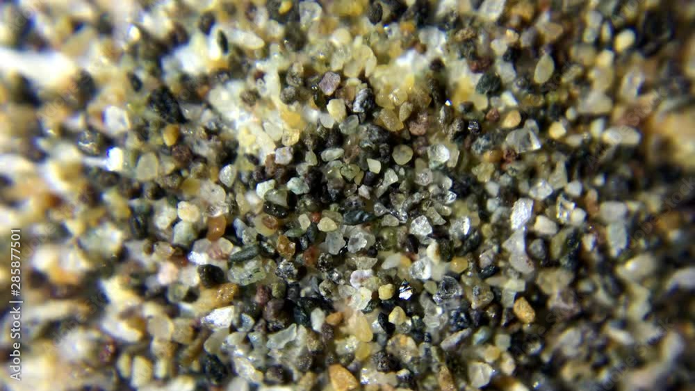 Macroscopic view of sand rotation.Using macro lens to capture microscopic details. Close up of sand detail.Top view. Macroscopic view of sand rotation.Using macro lens to capture microscopic details. Close up of sand detail.Top view.