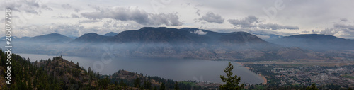 Panoramic view of Penticton City during a cloudy and smokey summer morning. Taken in Skaha Bluffs Provincial Park, British Columbia, Canada.