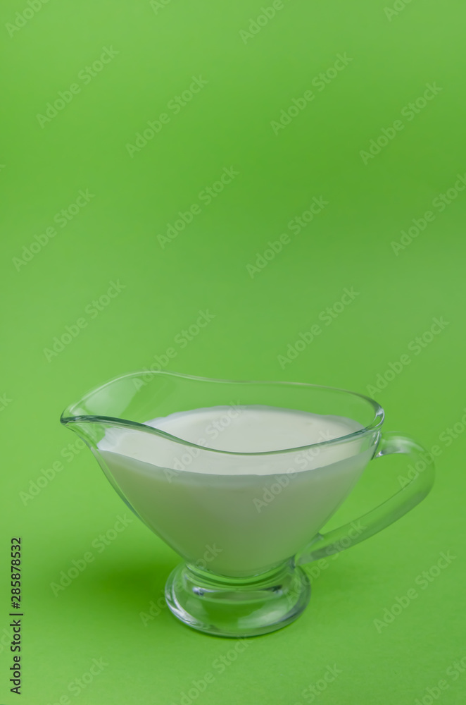dairy products fresh sour cream on a green background dairy products fresh sour cream on a green background