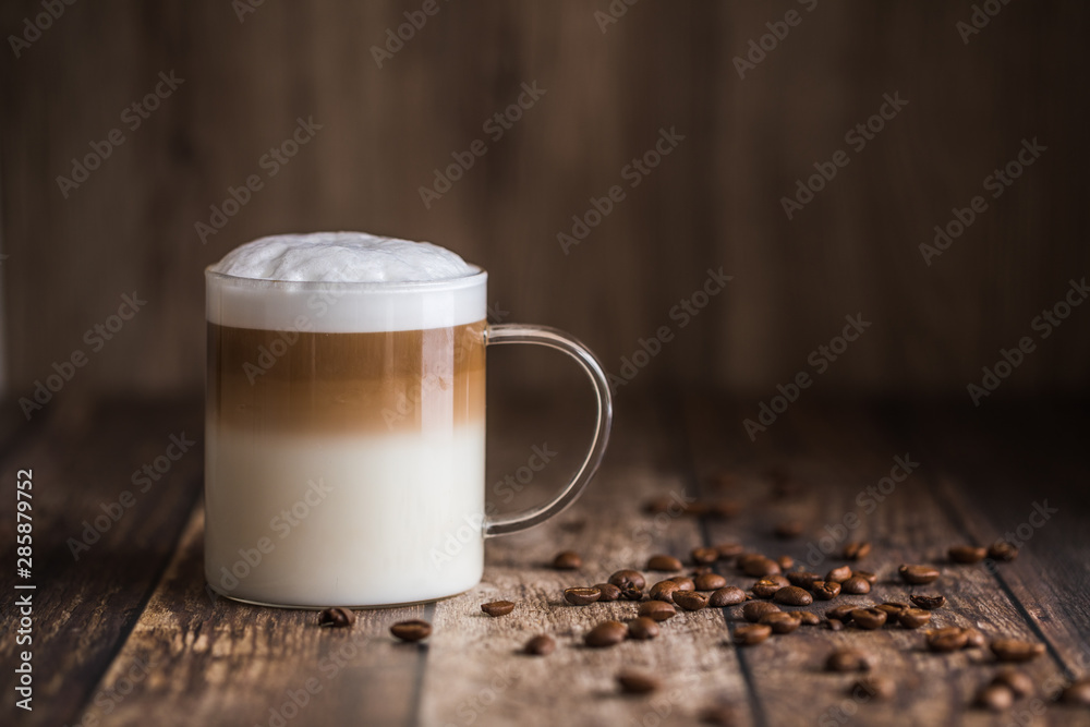 Cafe latte macchiato layered coffee in a see through glass cup Stock Photo  | Adobe Stock