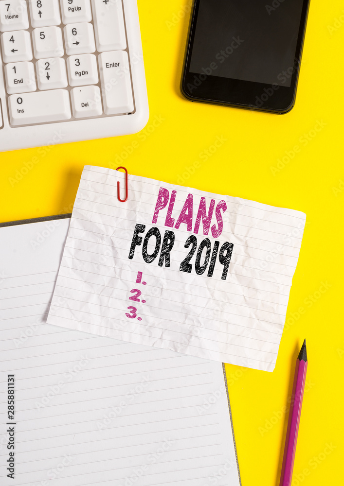 Text sign showing Plans For 2019. Business photo text an intention or decision about what one is going to do Crumpled white paper on table with paper clips clock mobile and pc keyboard Text sign showing Plans For 2019. Business photo text an intention or decision about what one is going to do Crumpled white paper on table with paper clips clock mobile and pc keyboard