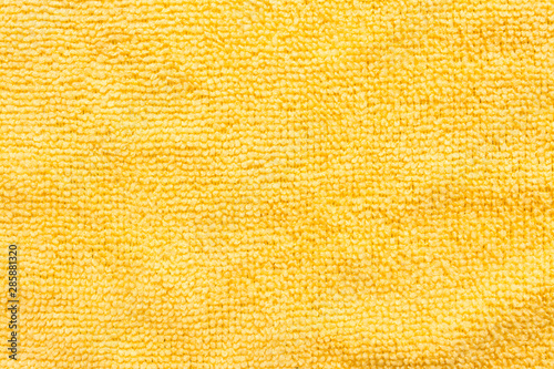 Surface of yellow microfiber cloth  macro textile pattern background