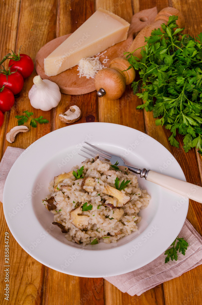 Risotto with mushrooms, fresh herbs and parmesan cheese. Risotto with mushrooms, fresh herbs and parmesan cheese.
