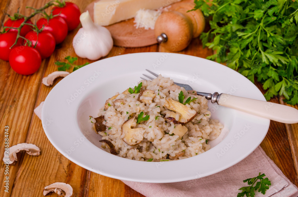 Risotto with mushrooms, fresh herbs and parmesan cheese. Risotto with mushrooms, fresh herbs and parmesan cheese.