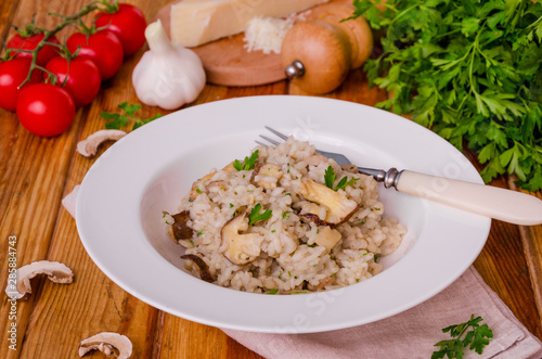 Risotto with mushrooms, fresh herbs and parmesan cheese.