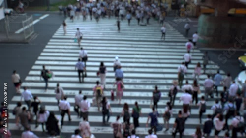 Wallpaper Mural UMEDA, OSAKA, JAPAN - CIRCA JULY 2019 : Aerial blurred view of zebra crossing near Osaka train station. Crowd of people at the street. Shot in busy rush hour. Torontodigital.ca