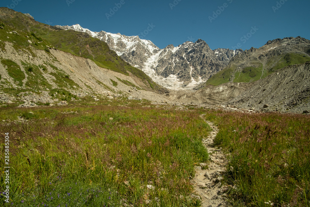 View on Shkara glacier with high mountains in the background. Close to Ushguli village, Svaneti region, Georgia.