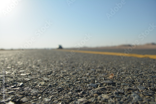 close up of asphalt road in desert