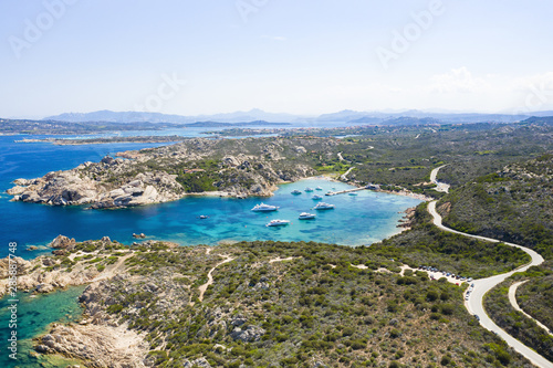 Obraz na płótnie View from above, stunning aerial view of the Maddalena Archipelago National Park with some islands surrounded by a beautiful turquoise clear sea, Caprera island in the distance. Sardinia, Italy. w salonie