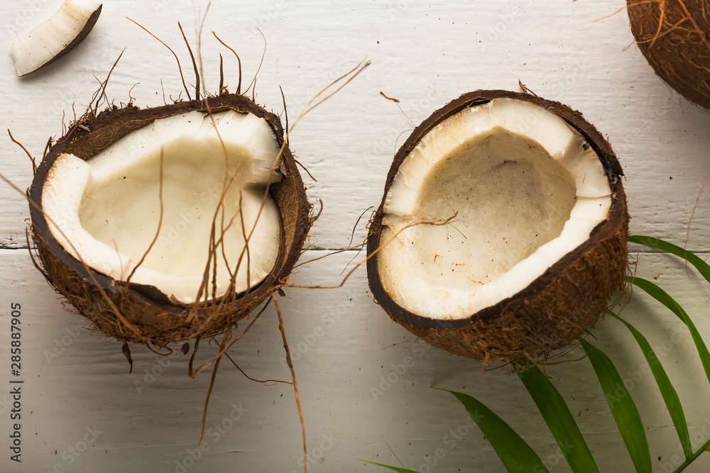 Coconuts on a white wooden table Coconuts on a white wooden table
