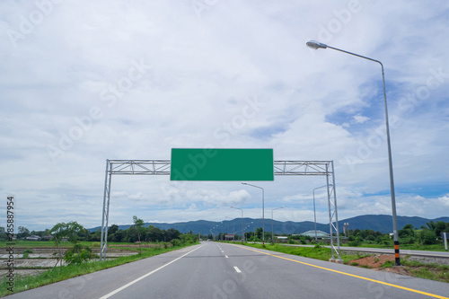 Empty road with blank highway sign board photo