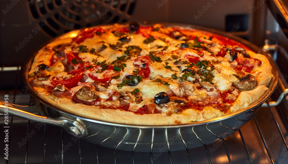 pizza cooked in the oven in the kitchen