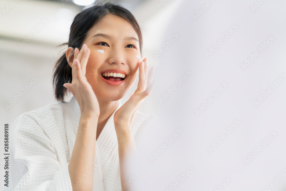 attractive freshness asian woman clean face fresh water with care look to mirror in bathroom home background attractive freshness asian woman clean face fresh water with care look to mirror in bathroom home background