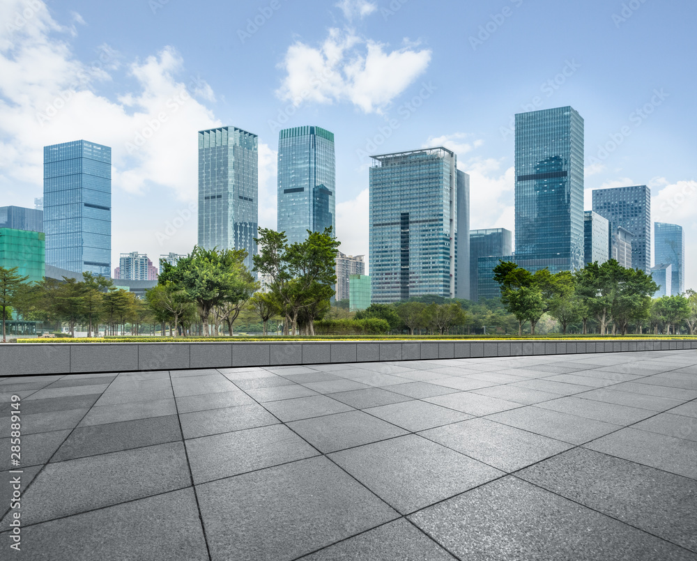 Panoramic skyline and buildings with empty square floor.