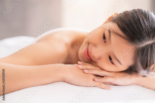 attractive asian woman enjoy and clam oriental massage therapy white bed healthy life ideas concept