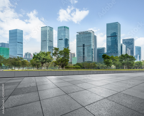 Panoramic skyline and buildings with empty square floor. © hallojulie