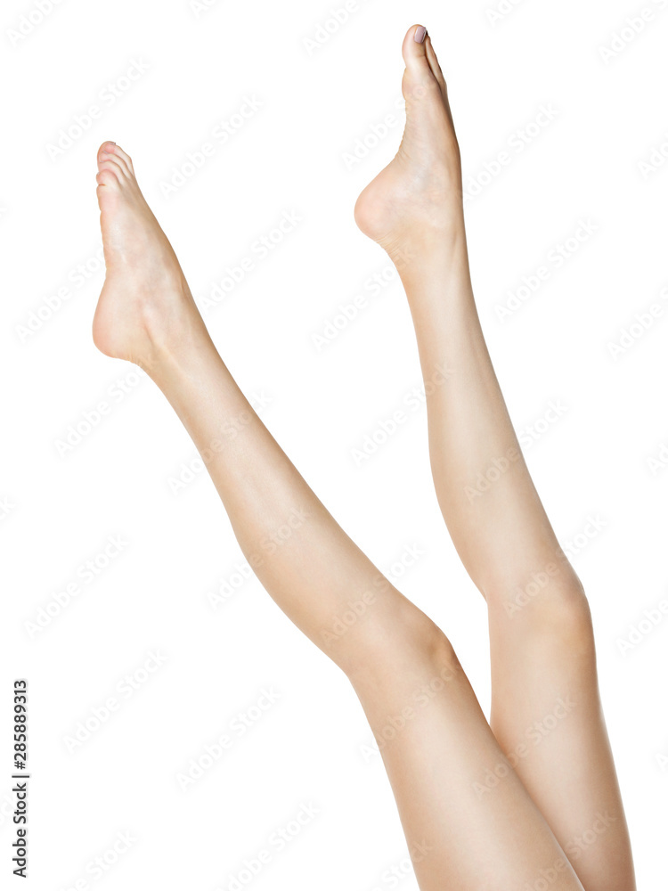 Beautiful female legs isolated on white Beautiful female legs isolated on white