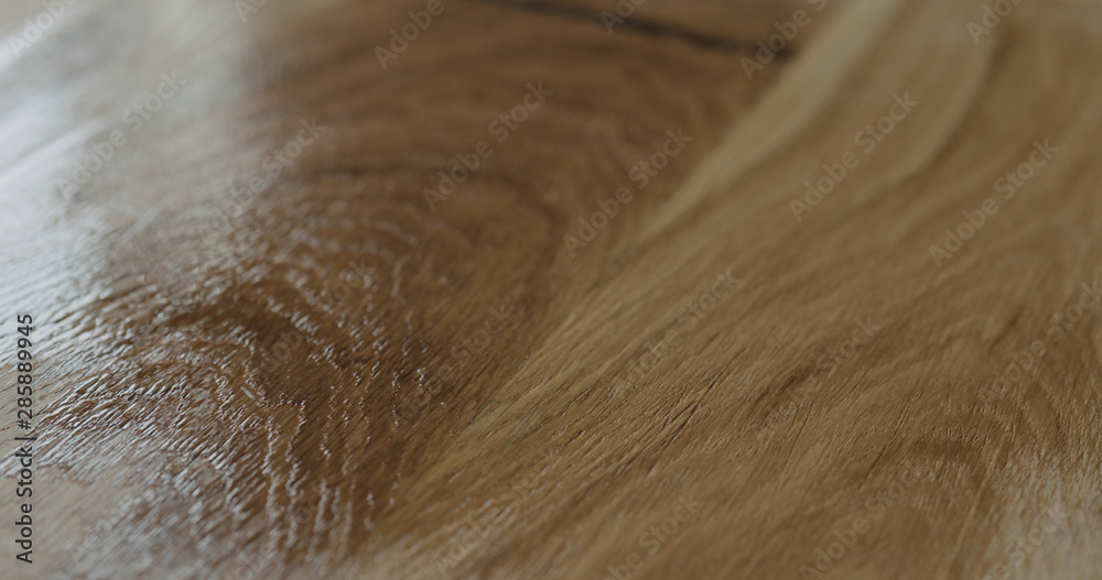 Fototapeta premium applying oil finish to oak surface with brush