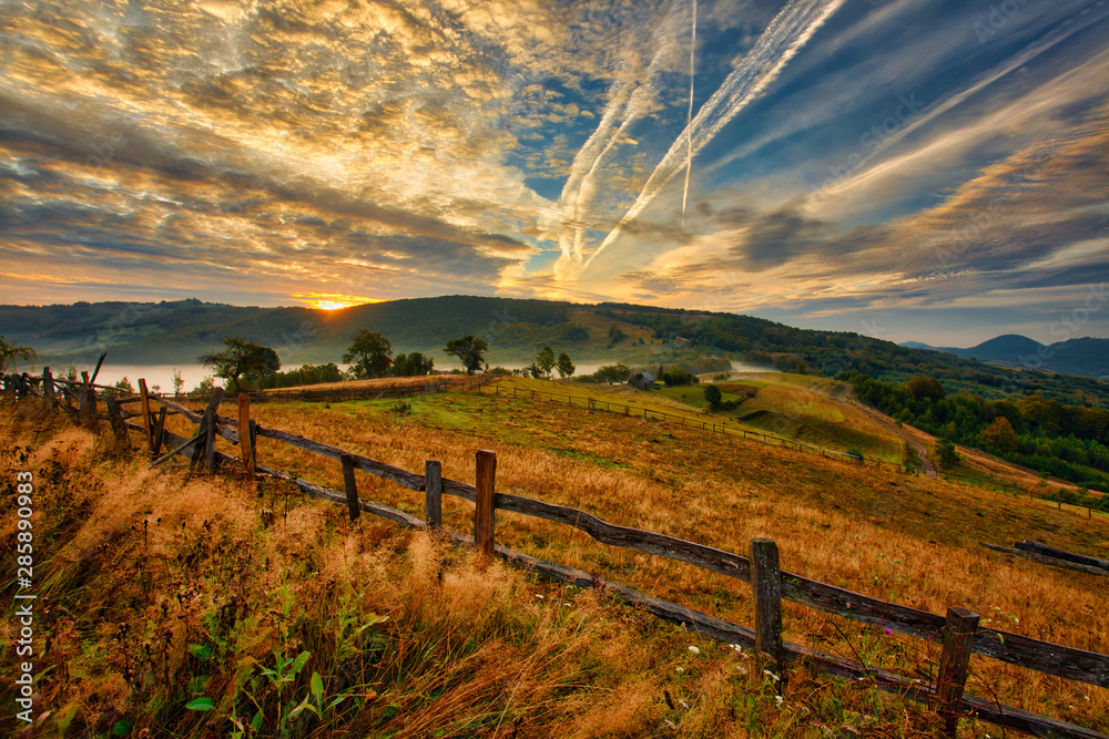 Magestic sunset in the carpatian mountains. Natural autumn landscape.