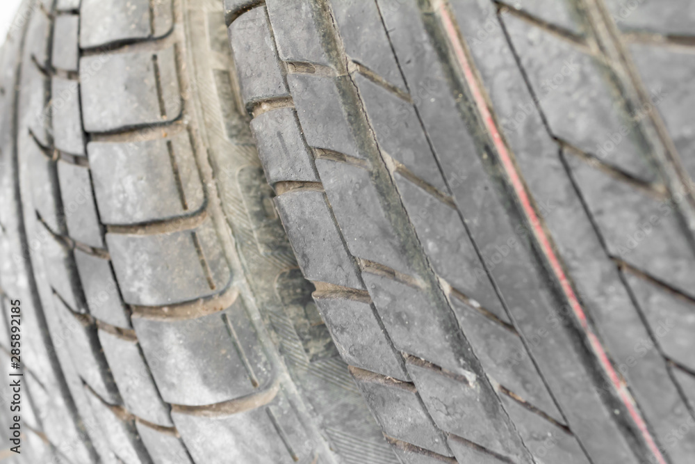 Old used tires stacked close up. Old used tires stacked close up.