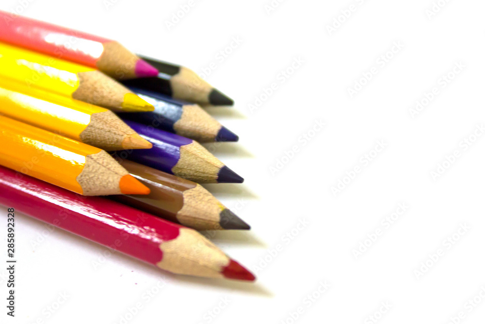 Close up of color pencils on white background, isolated. Close up of color pencils on white background, isolated.