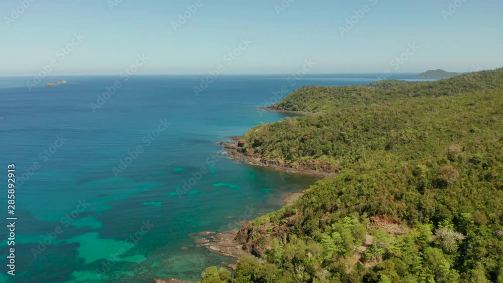 Aerial drone coastline of tropical island with coral reef and blue lagoon. Palawan, Philippines. tropical landscape. Seascape island and clear blue water. tropical landscape, travel concept Aerial drone coastline of tropical island with coral reef and blue lagoon. Palawan, Philippines. tropical landscape. Seascape island and clear blue water. tropical landscape, travel concept