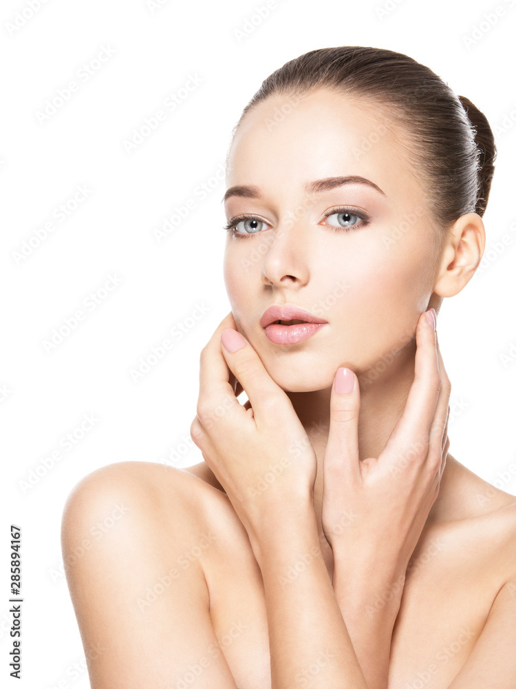 Young woman with healthy clean skin touches the face. Skin care concept. Young woman with healthy clean skin touches the face. Skin care concept.