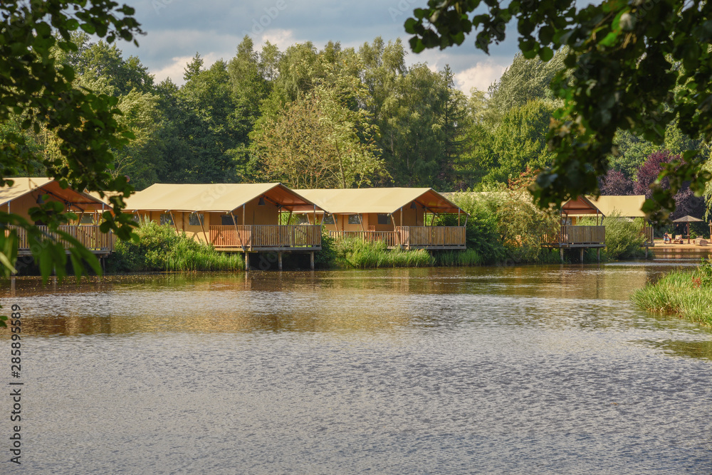 Families adventure Lodges for great adventurers and researchers at the lake in a amusement park . Holiday in park, in outdoor Families adventure Lodges for great adventurers and researchers at the lake in a amusement park . Holiday in park, in outdoor