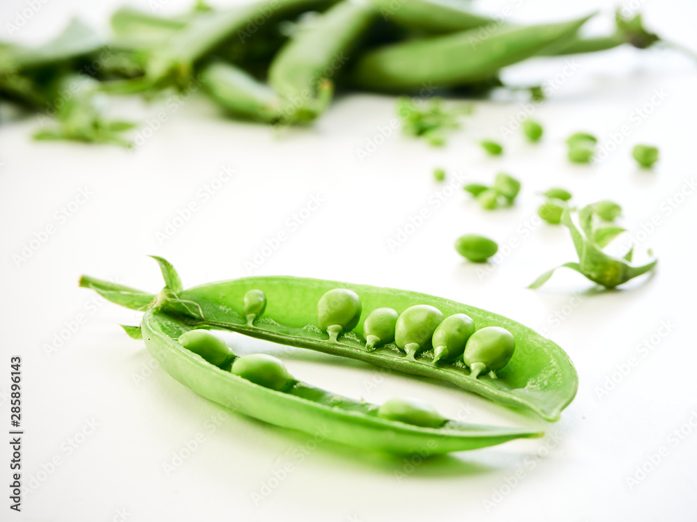 green pea pod on white background green pea pod on white background