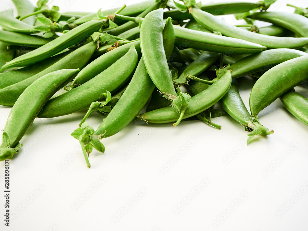 green pea pod on white background green pea pod on white background
