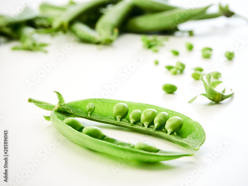 green pea pod on white background