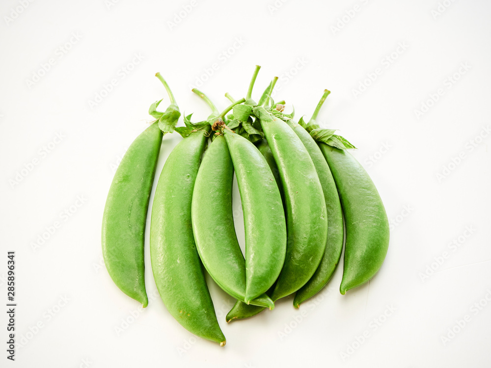 green pea pod on white background green pea pod on white background