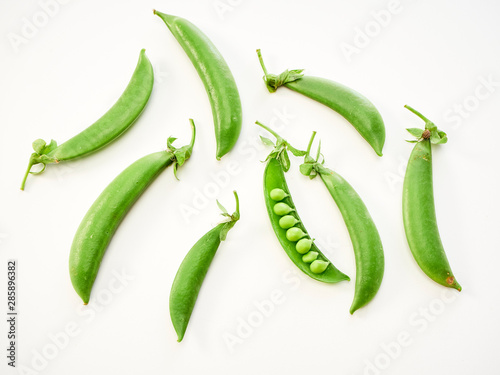 green pea pod on white background