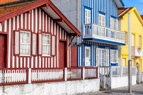 Street with colorful houses in Costa Nova, Aveiro, Portugal. Street with striped houses, Costa Nova, Aveiro, Portugal. Facades of colorful houses in Costa Nova, Aveiro, Portugal.