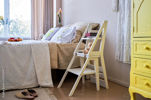 Use of folding stepladder chair in bedroom