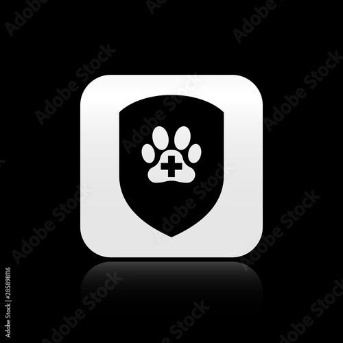 Black Animal health insurance icon isolated on black background. Pet protection icon. Dog or cat paw print. Silver square button. Vector Illustration