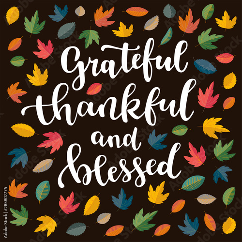 Grateful, thankful and blessed. Thanksgiving quote. Fall modern calligraphic hand drawn greeting card with scatterev colorful flat autumn falling leaves. Autumn colored artwork, print in vector