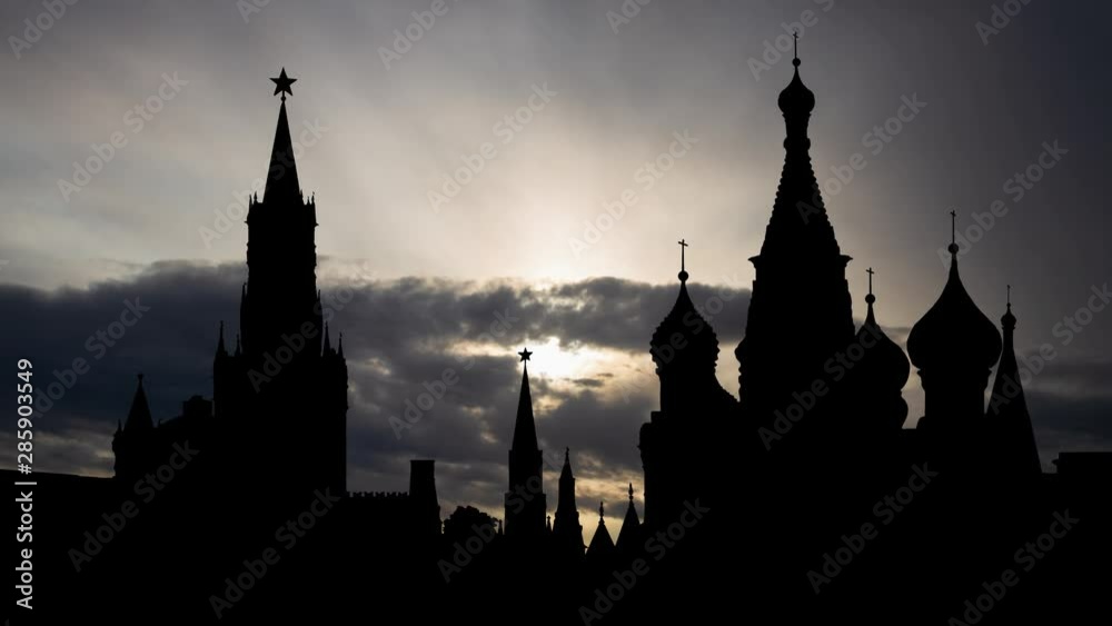 Moscow: Kremlin or Spasskaya Tower with Saint Basil's Cathedral in Red Square, Time Lapse at Sunrise, Capital of Russia, Europe Moscow: Kremlin or Spasskaya Tower with Saint Basil's Cathedral in Red Square, Time Lapse at Sunrise, Capital of Russia, Europe