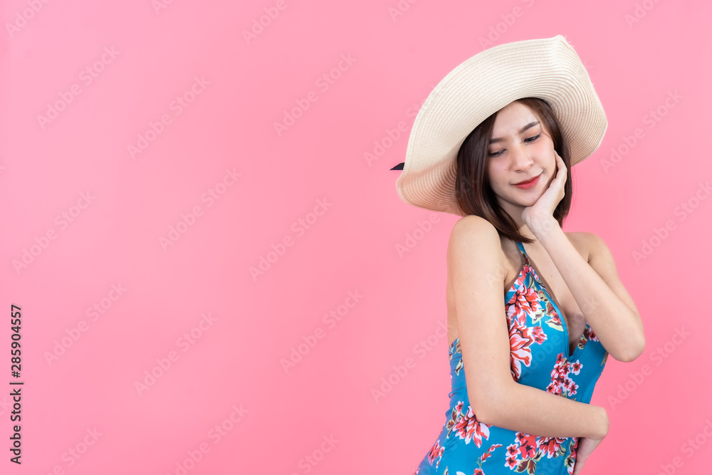 eautiful,Sexy asian girl standing on pink background in a colors bathing suit bikini and smiling.concept style vogue eautiful,Sexy asian girl standing on pink background in a colors bathing suit bikini and smiling.concept style vogue