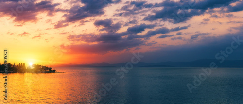Beautiful sunset or sunrise above the sea. Tropical sunset or sunrise over sea. Colourful sunset or sunrise over water. © daliu
