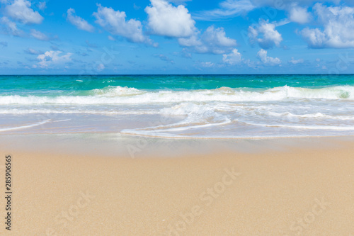 Tropical sea beach white wave against blue sky cloud