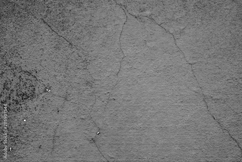 Obraz premium Texture of a concrete wall with cracks and scratches which can be used as a background