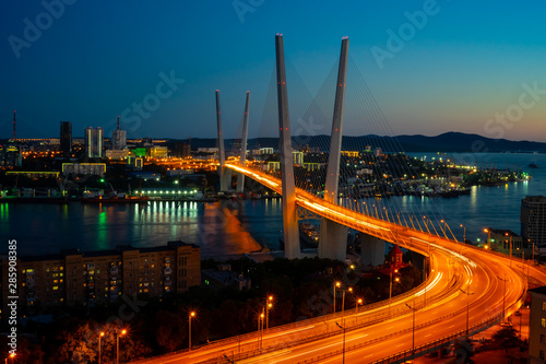 Cityscape overlooking the Golden bridge in blue hour. Bright illumination adorns the night city.