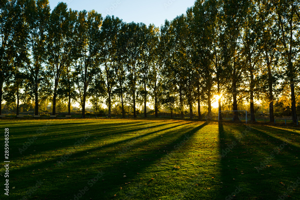 empty football ground at countryside, autumn sunset empty football ground at countryside, autumn sunset