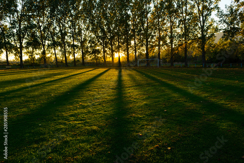 empty football ground at countryside  autumn sunset