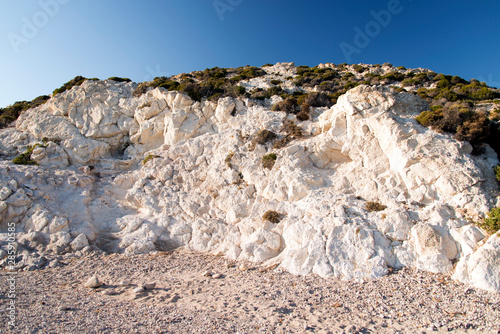 A view of a rocky beach with no people in Patmos, Greece photo